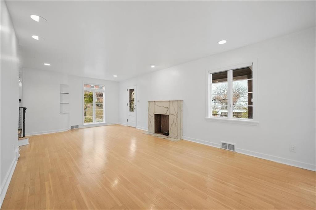 2800 Fernwald Road Pittsburgh, PA 15217 - Photo 7 of 37 an empty room with windows and fireplace
