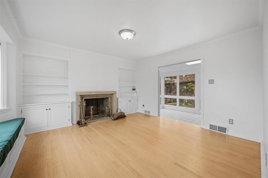 2800 Fernwald Road Pittsburgh, PA 15217 - Photo 10 of 37 a view of an empty room with a window and fireplace