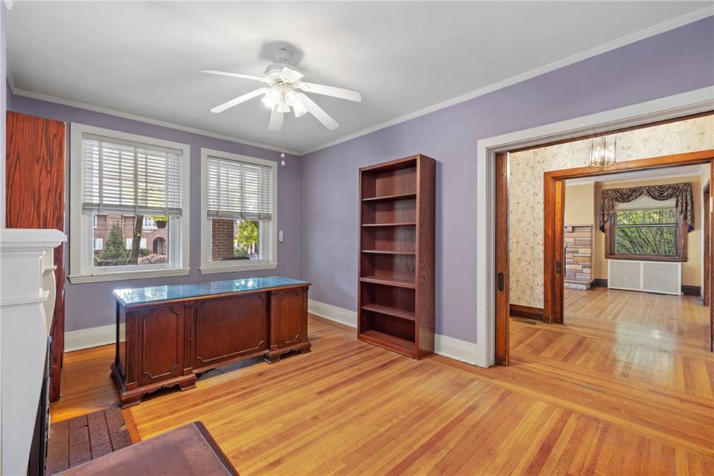 5515 Darlington Road Pittsburgh, PA 15217 - Photo 11 of 50 a view of an empty room with a window and wooden floor