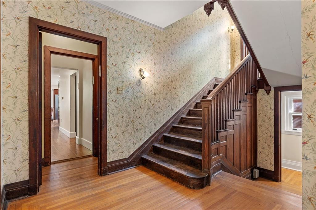 5515 Darlington Road Pittsburgh, PA 15217 - Photo 12 of 50 a view of a hallway with wooden floor and staircase