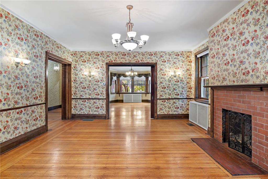 5515 Darlington Road Pittsburgh, PA 15217 - Photo 24 of 50 a view of an empty room with window and wooden floor