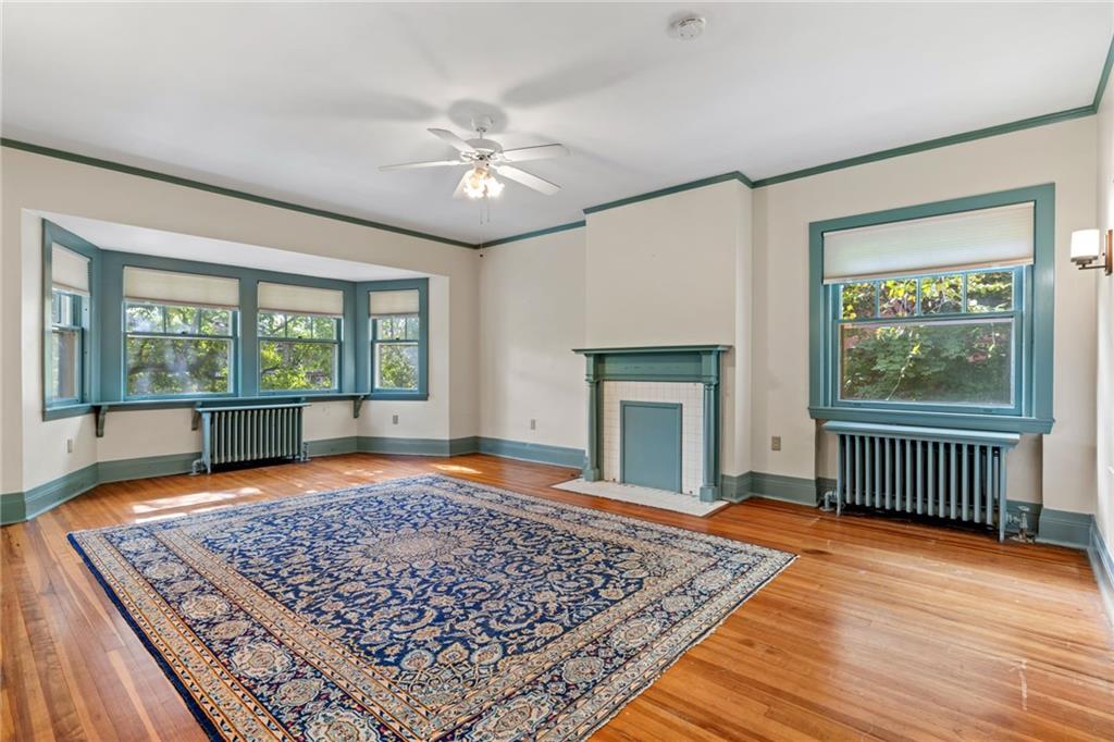 5515 Darlington Road Pittsburgh, PA 15217 - Photo 29 of 50 a view of a livingroom with wooden floor and a fireplace
