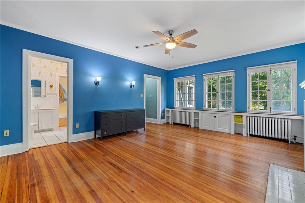 5515 Darlington Road Pittsburgh, PA 15217 - Photo 35 of 50 a view of empty room with wooden floor and fan