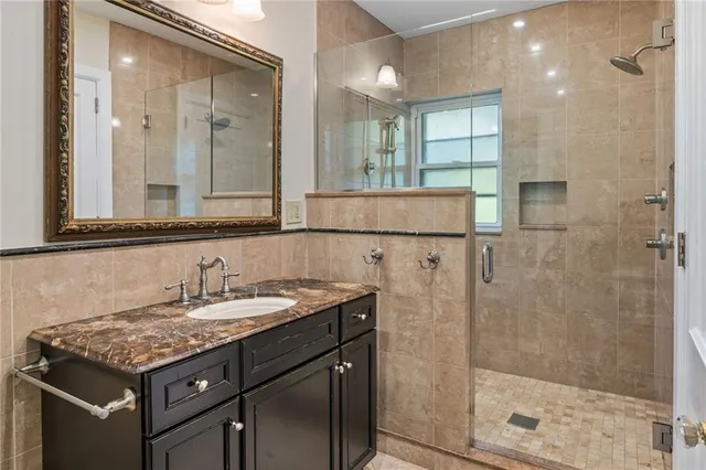 a utility room with sink dryer and washer