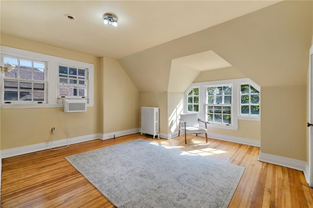5515 Darlington Road Pittsburgh, PA 15217 - Photo 47 of 50 an empty room with wooden floor and windows
