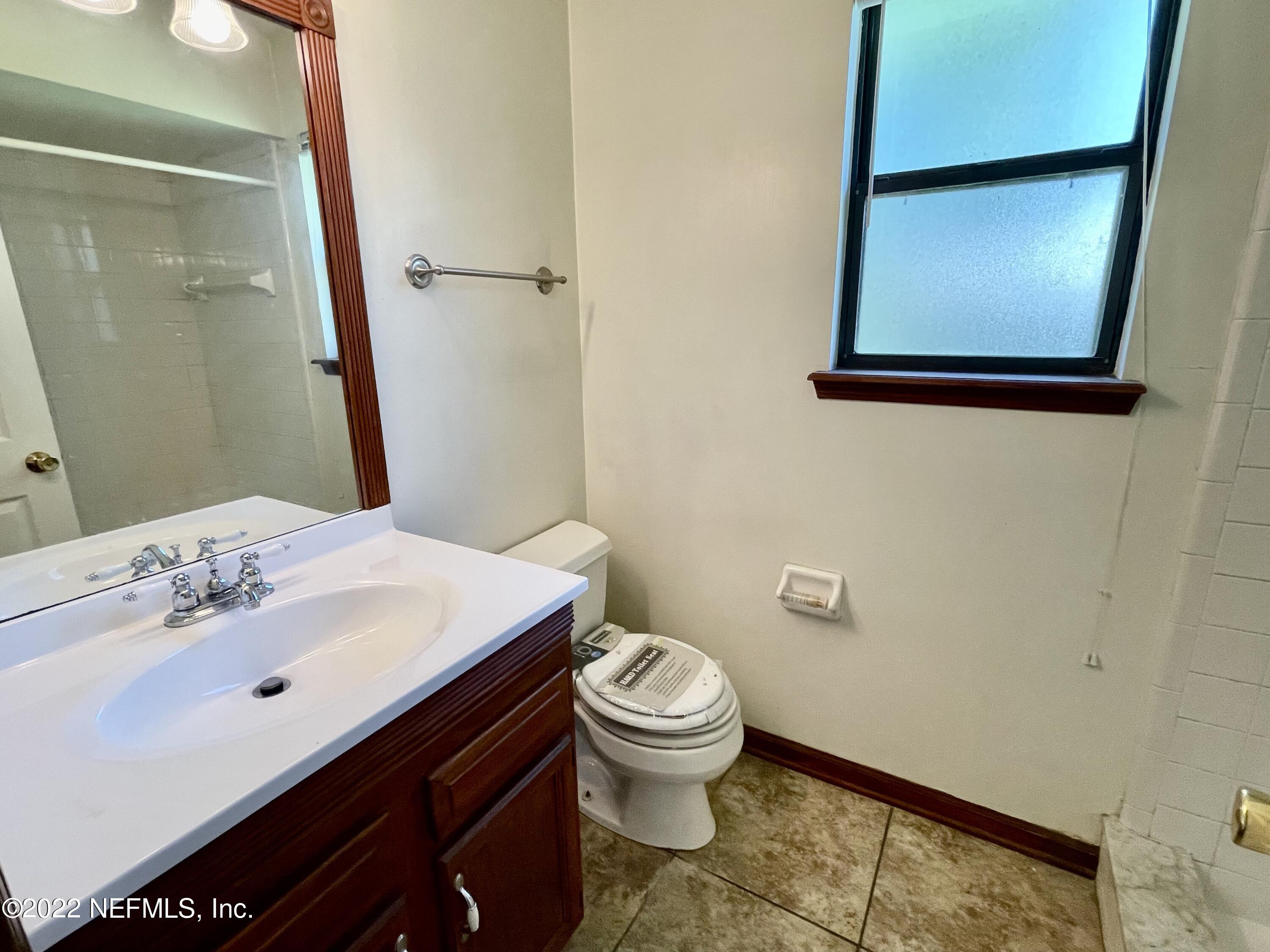 3248 Merganzer Trail Orange Park, FL 32065 - Photo 12 of 17 a bathroom with a sink a toilet and mirror