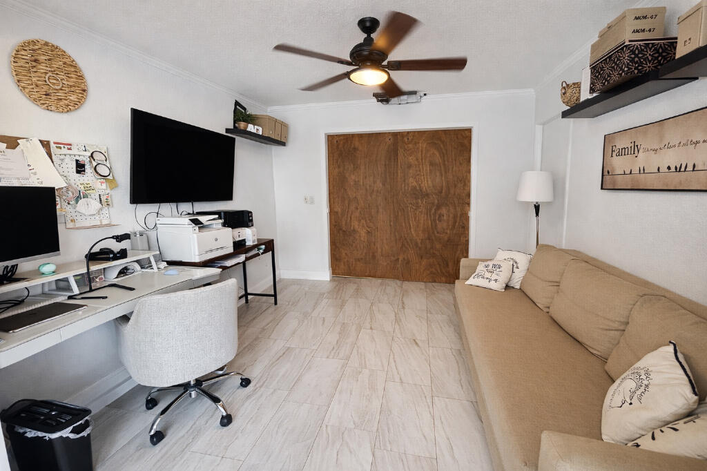 5408 Jackson Street Hollywood, FL 33021 - Photo 14 of 42 a living room with furniture and a flat screen tv