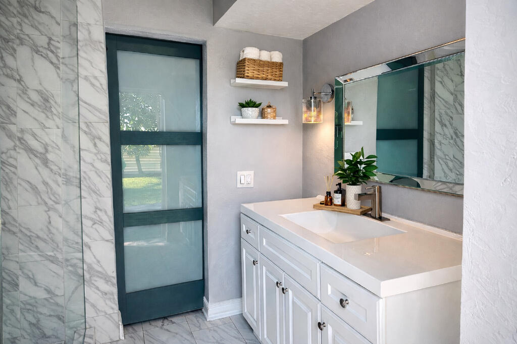 5408 Jackson Street Hollywood, FL 33021 - Photo 29 of 42 a bathroom with a sink and a mirror