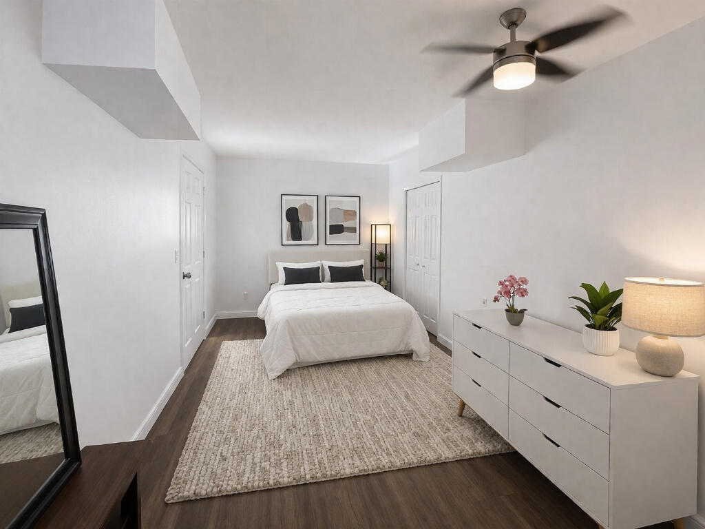5408 Jackson Street Hollywood, FL 33021 - Photo 31 of 42 a bedroom with a large bed and a chandelier