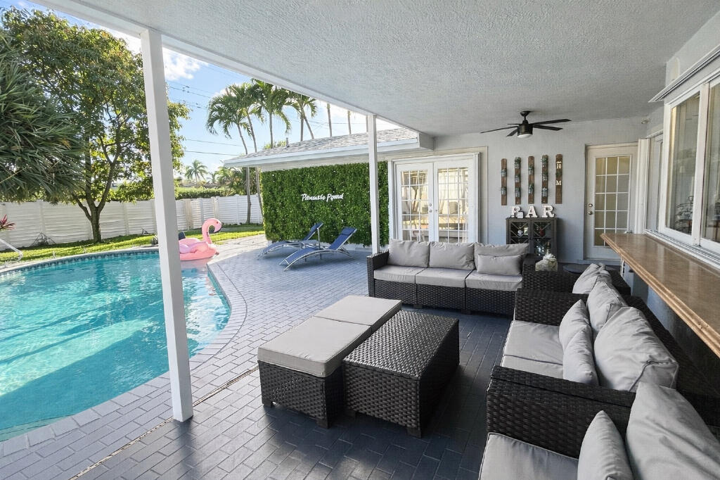 5408 Jackson Street Hollywood, FL 33021 - Photo 34 of 42 a living room with furniture and a large window