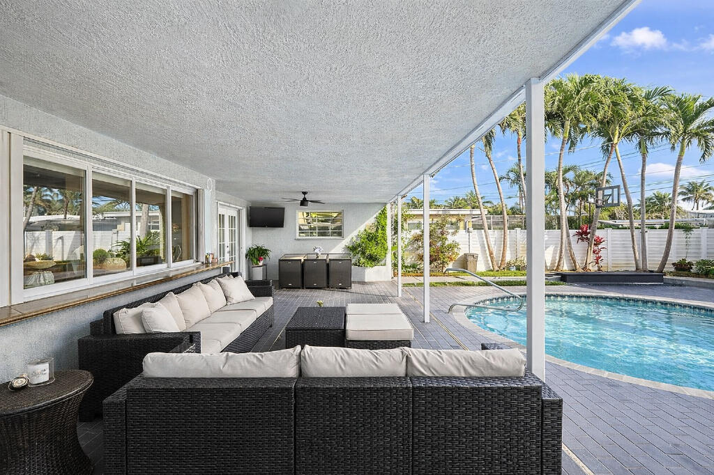 5408 Jackson Street Hollywood, FL 33021 - Photo 35 of 42 a living room with furniture and a large window