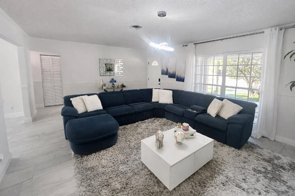 5408 Jackson Street Hollywood, FL 33021 - Photo 10 of 42 a living room with furniture and a large window