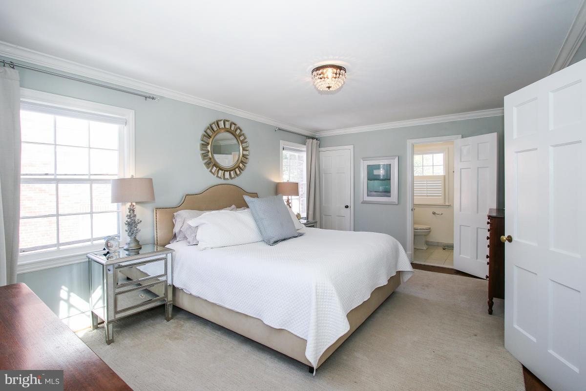 3231 Rittenhouse Street Northwest Washington, DC 20015 - Photo 17 of 27 a bedroom with a bed and window