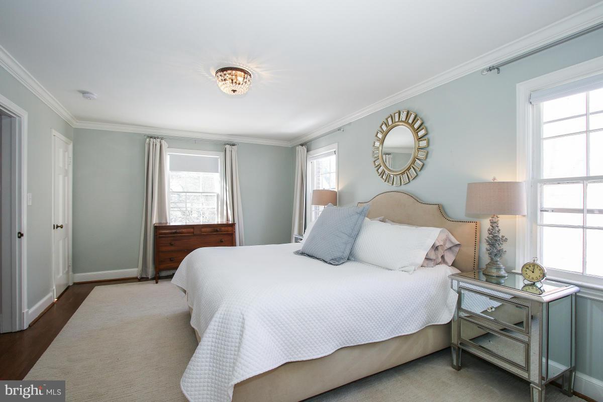 3231 Rittenhouse Street Northwest Washington, DC 20015 - Photo 18 of 27 a bedroom with a bed and a window
