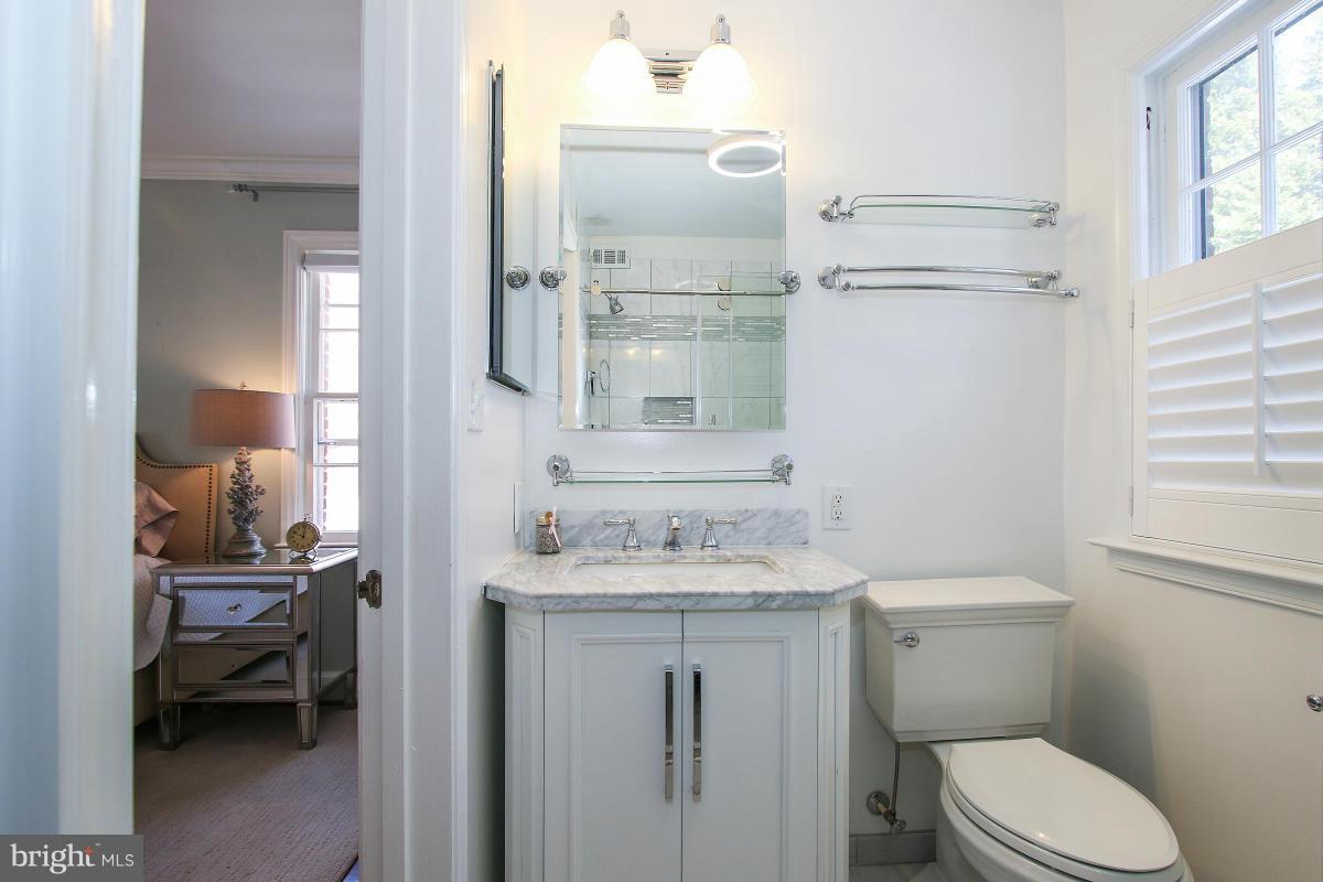3231 Rittenhouse Street Northwest Washington, DC 20015 - Photo 19 of 27 a bathroom with a sink toilet vanity and tub