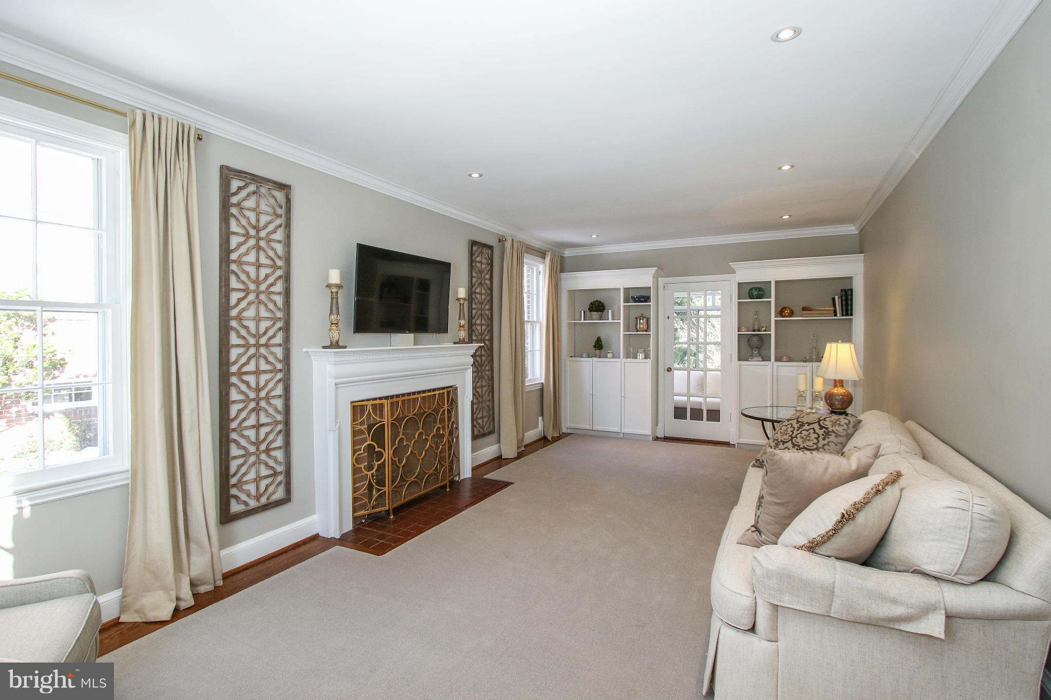 3231 Rittenhouse Street Northwest Washington, DC 20015 - Photo 3 of 27 a living room with furniture and a flat screen tv