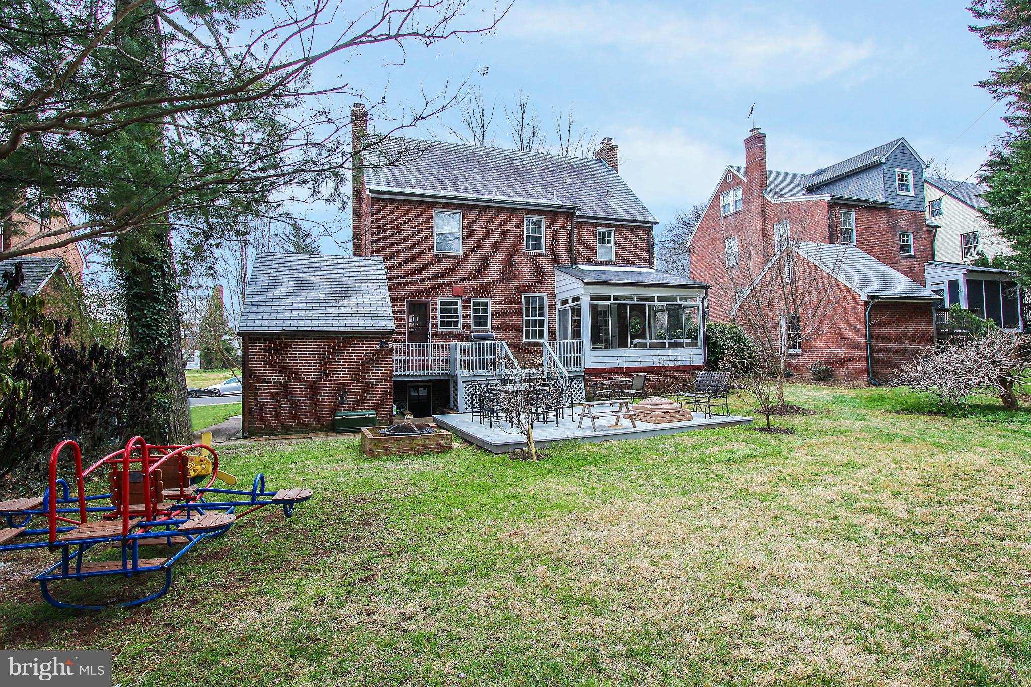 3231 Rittenhouse Street Northwest Washington, DC 20015 - Photo 23 of 27 a view of a house with a yard and sitting area
