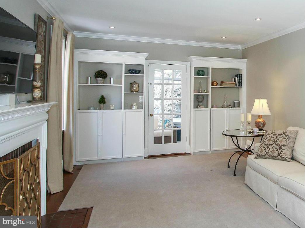 3231 Rittenhouse Street Northwest Washington, DC 20015 - Photo 4 of 27 a living room with furniture and a fireplace