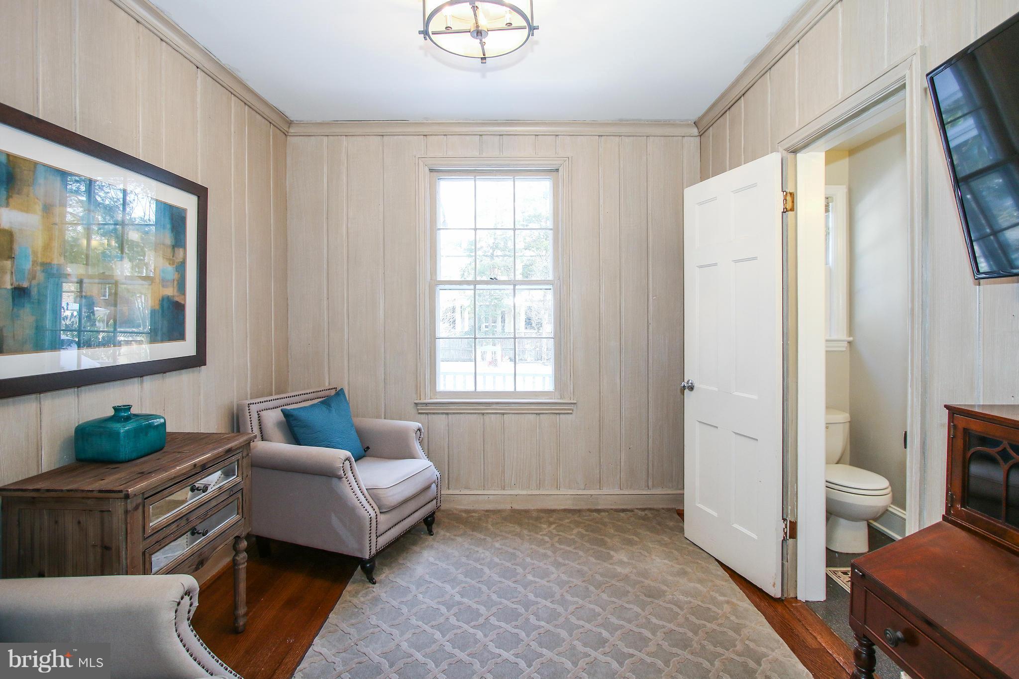 3231 Rittenhouse Street Northwest Washington, DC 20015 - Photo 6 of 27 a living room with furniture and a window