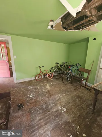 a room with wooden floor and a window