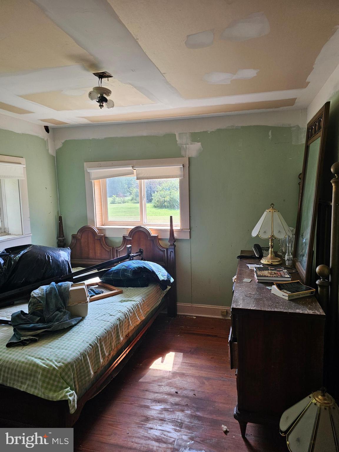 2695 Elsey Road Nanticoke, MD 21840 - Photo 27 of 46 a bedroom with a bed and a flat screen tv