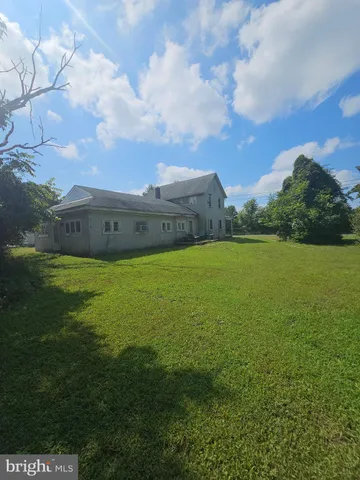 a view of a field with an ocean