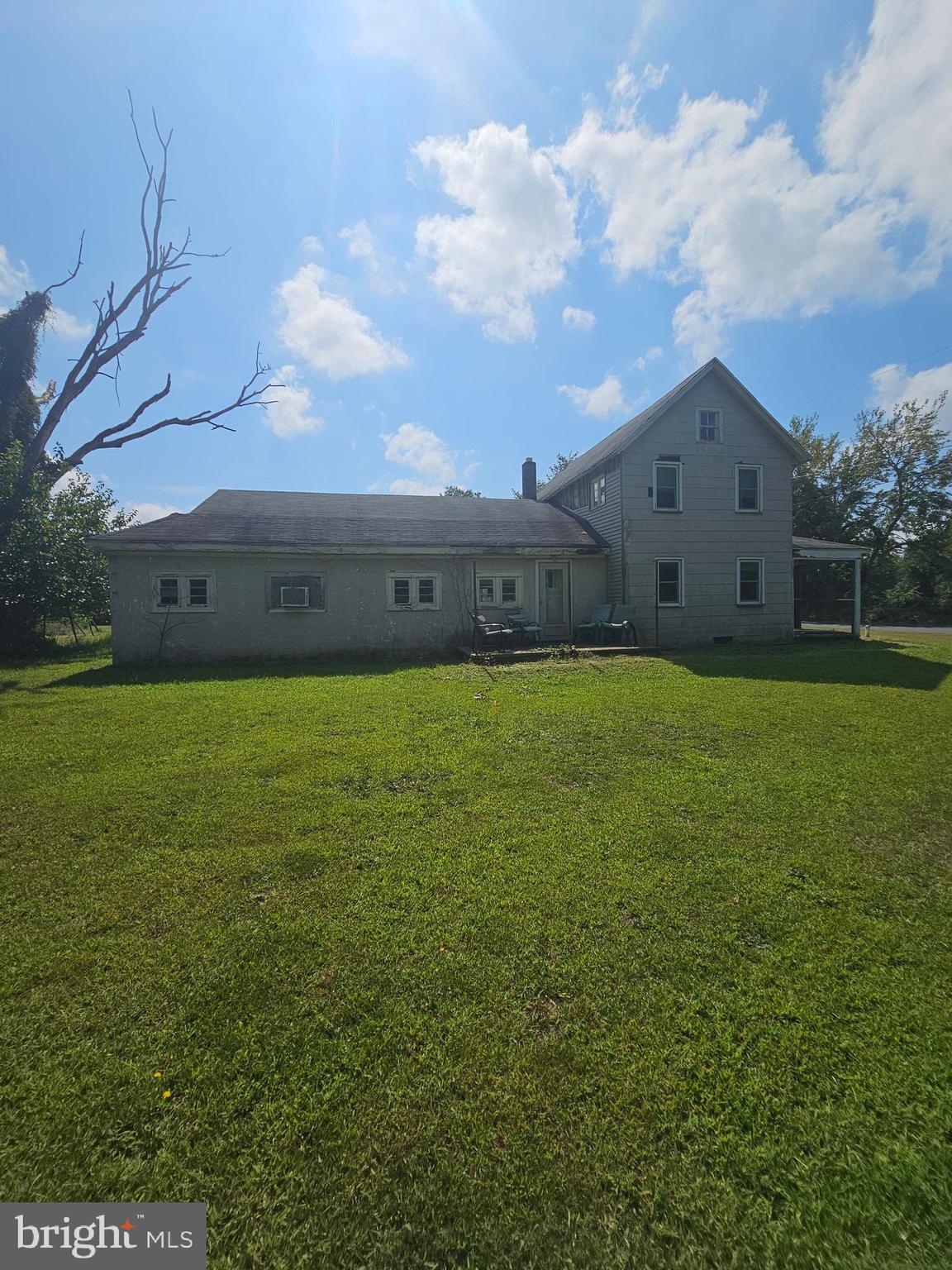 2695 Elsey Road Nanticoke, MD 21840 - Photo 8 of 46 a view of a house with a big yard and a large tree