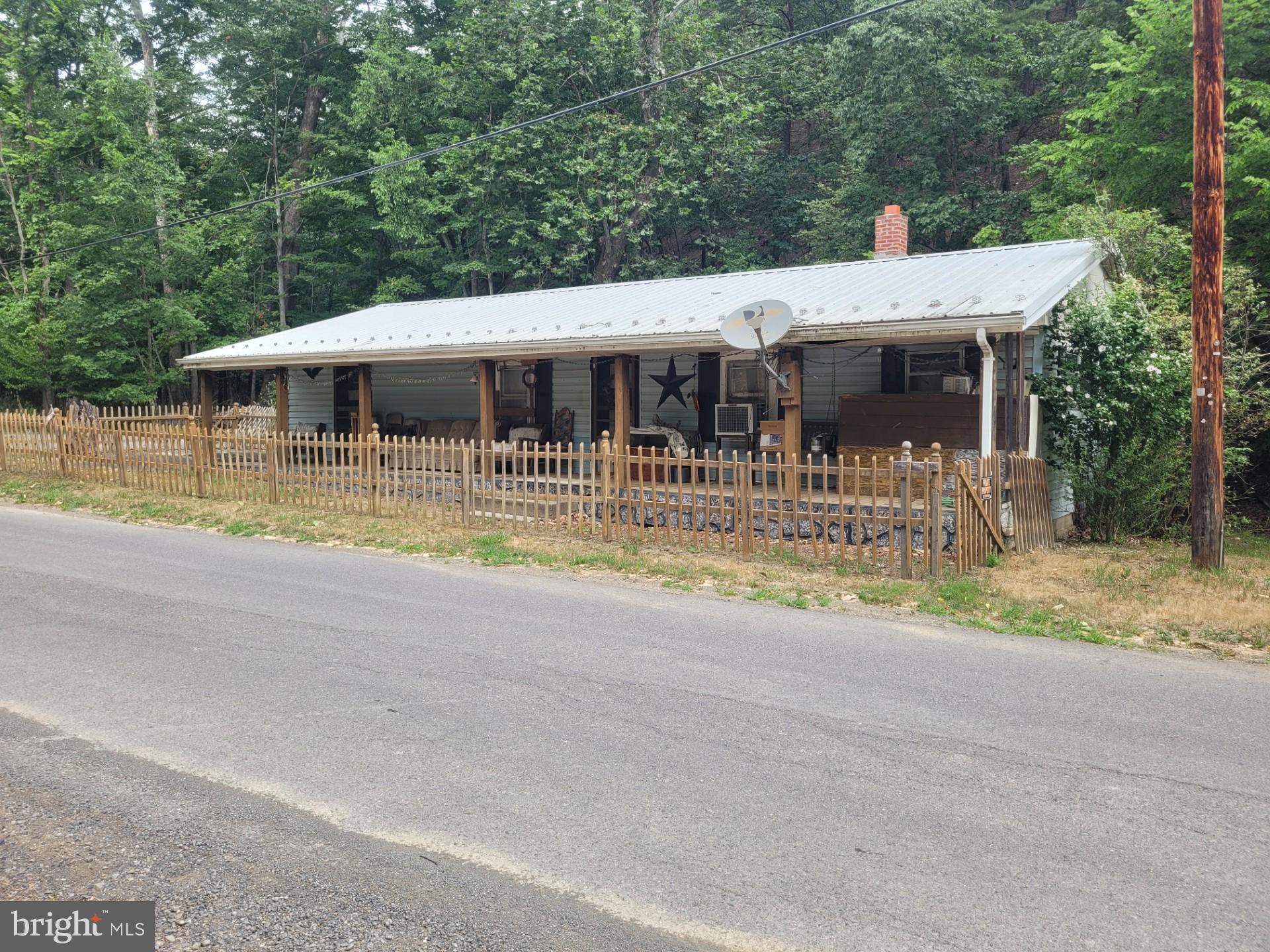 COZY CABIN ON .20 UNRESTRICTED ACRES WITH STREAM