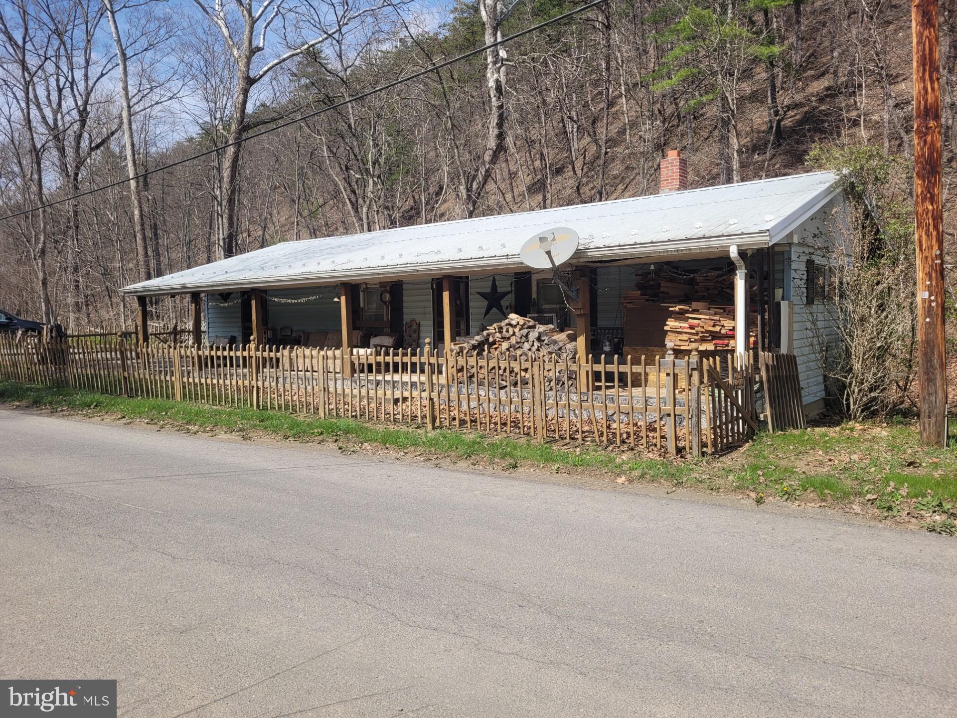 1224 Dry Run Road Burlington, WV 26710 - Photo 2 of 40 COZY CABIN WITH STREAM ON .20 UNRESTRICTED ACRES