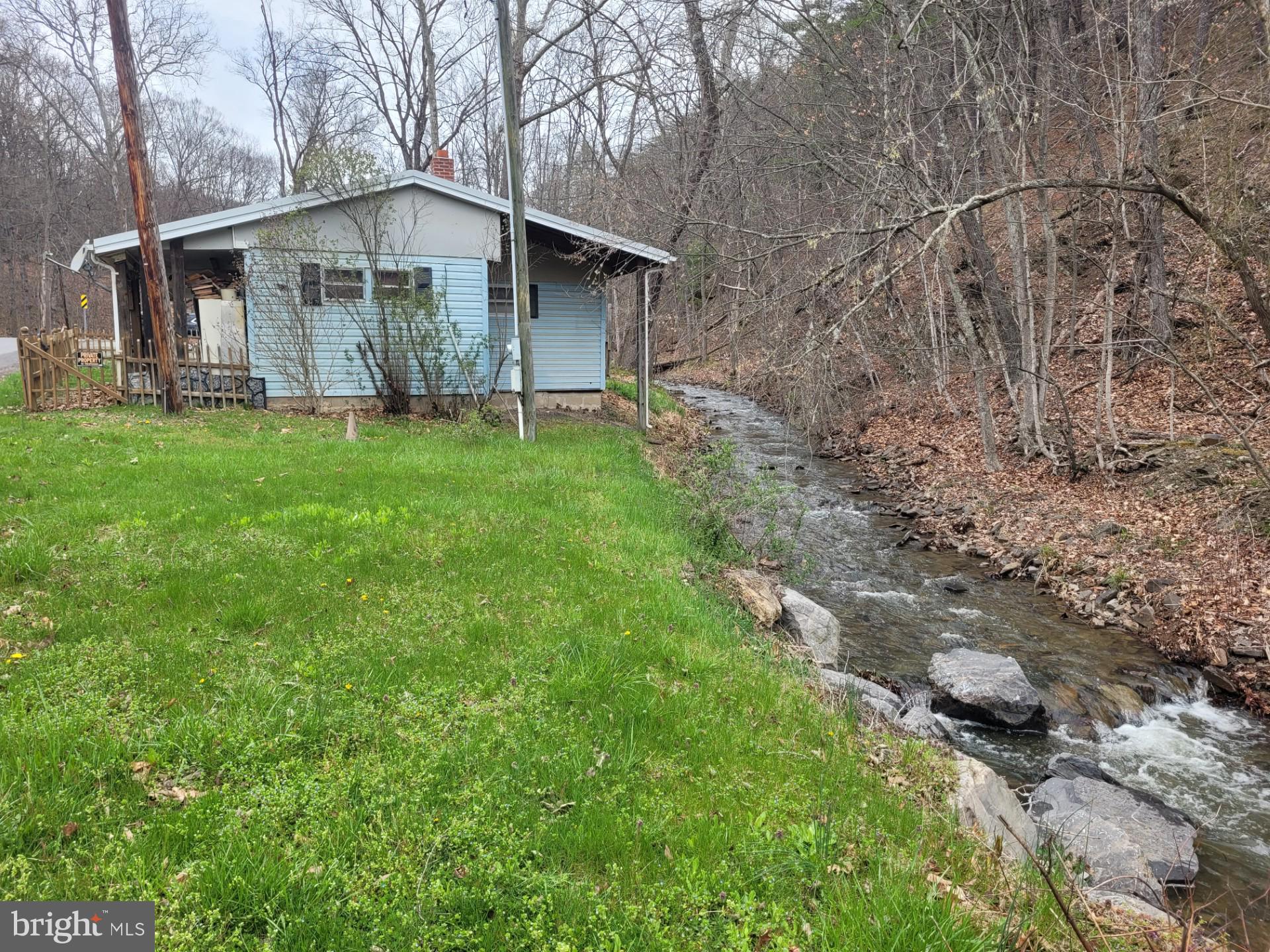 1224 Dry Run Road Burlington, WV 26710 - Photo 3 of 40 YEAR ROUND STREAM RIGHT OFF THE BACK PORCH