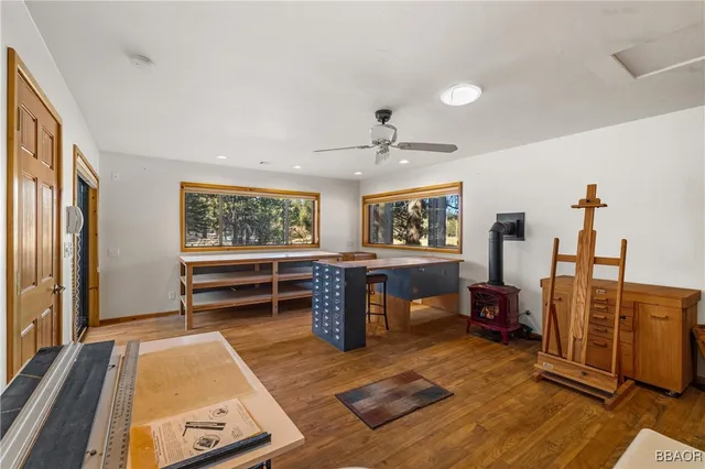 a bedroom with furniture and a large window