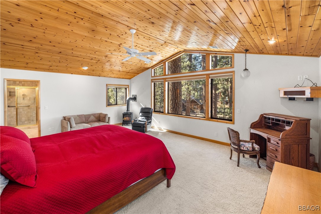 39585 Lakeview Pines Road Big Bear Lake, CA 92315 - Photo 31 of 49 a bed room with a bed and a chair