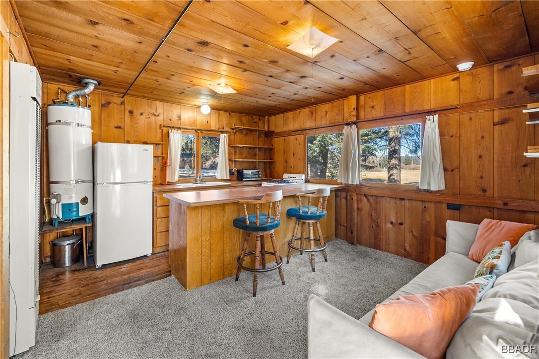 39585 Lakeview Pines Road Big Bear Lake, CA 92315 - Photo 40 of 49 a kitchen with stainless steel appliances granite countertop a sink and cabinets