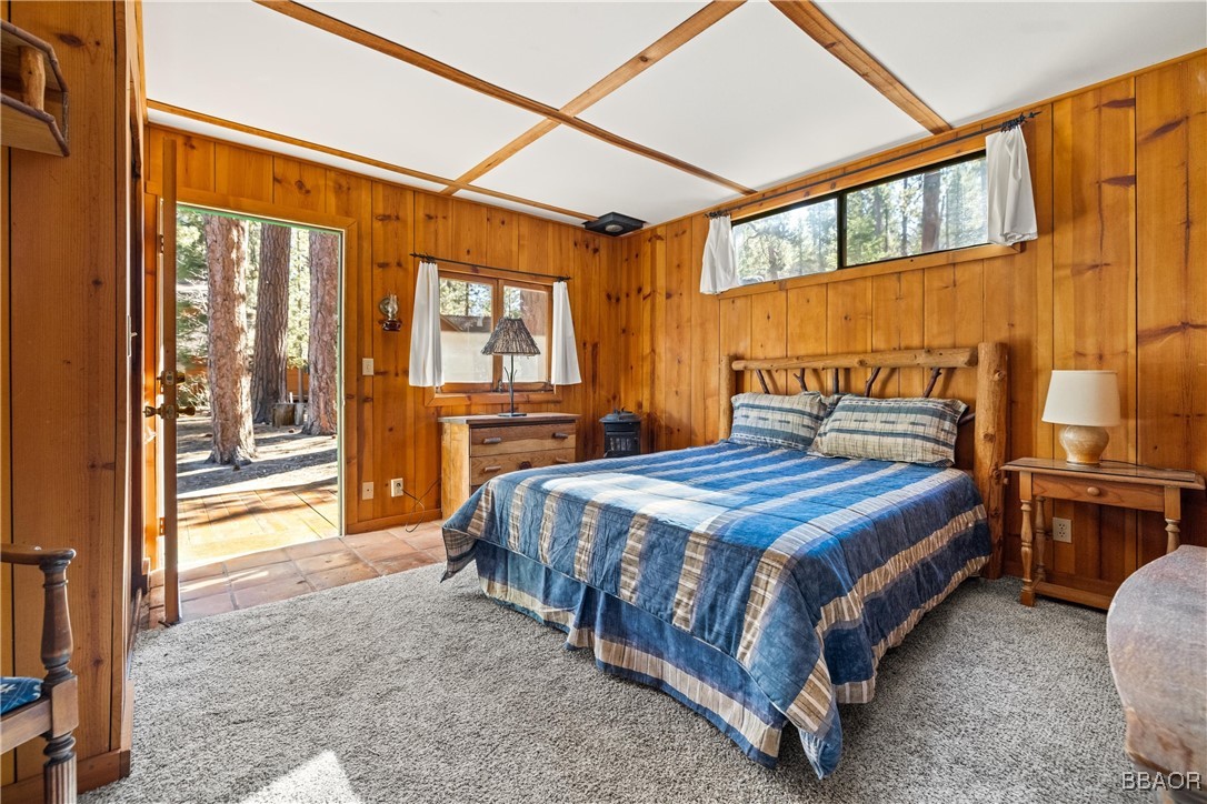 39585 Lakeview Pines Road Big Bear Lake, CA 92315 - Photo 43 of 49 a bed sitting in a bedroom next to a window