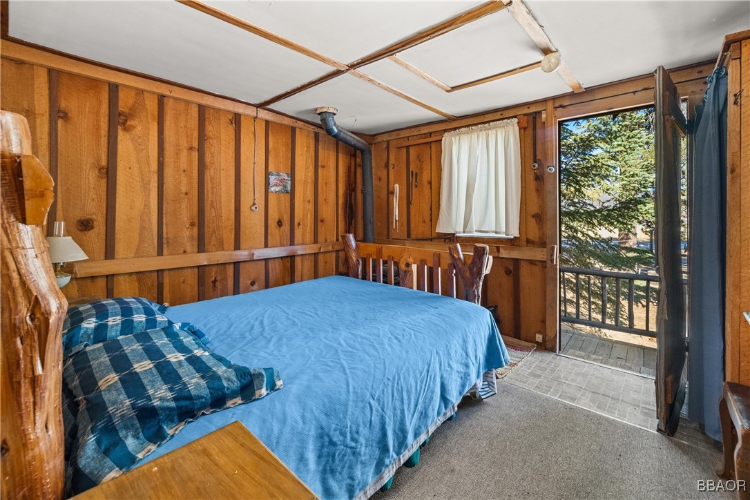 39585 Lakeview Pines Road Big Bear Lake, CA 92315 - Photo 47 of 49 a bed sitting in a bedroom next to a window