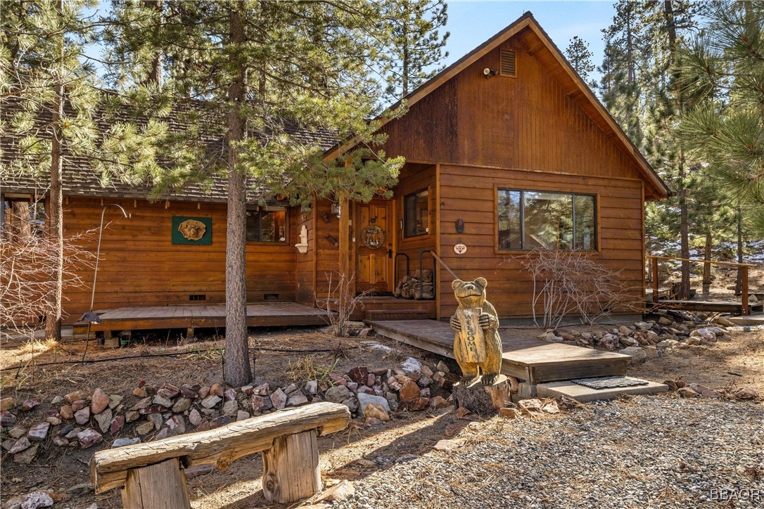 39585 Lakeview Pines Road Big Bear Lake, CA 92315 - Photo 9 of 49 a front view of a house with garden