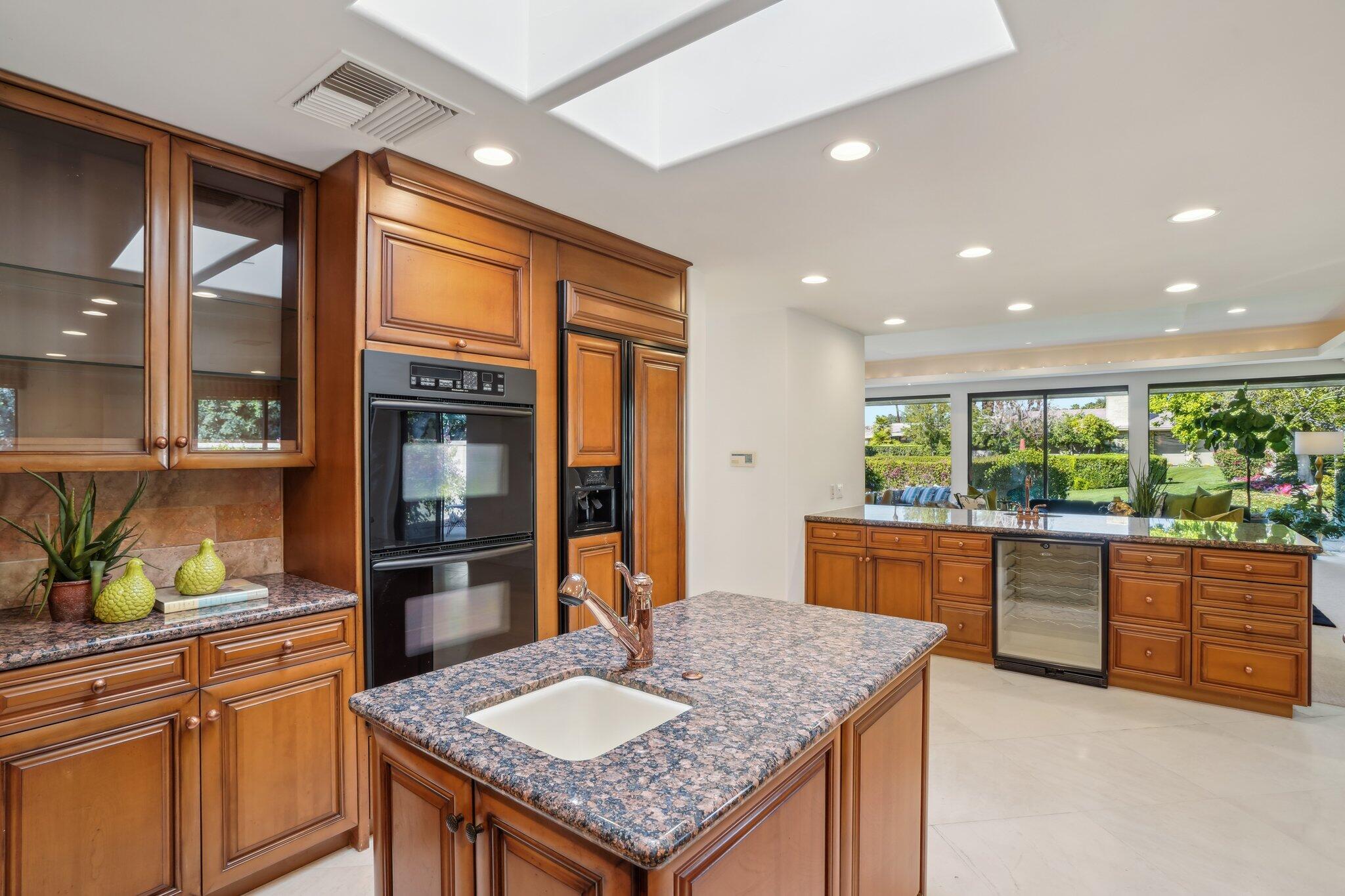 1 Exeter Court Rancho Mirage, CA 92270 - Photo 15 of 41 Kitchen open to living room