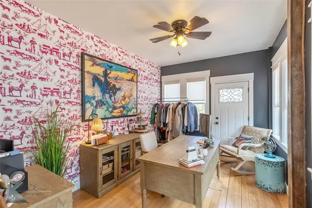 a view of a dining room with furniture and wooden floor