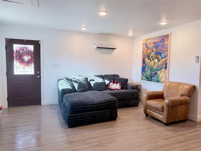 a living room with furniture and a window