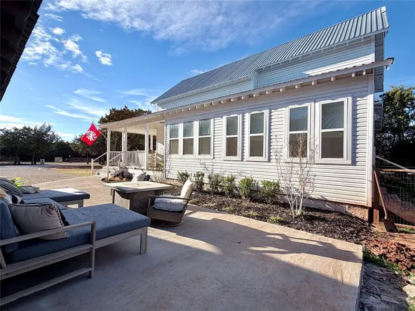 a view of a patio with couches and potted plants
