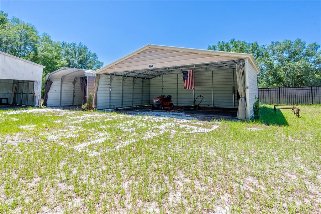 1750 Southwest 15th Street Bell, FL 32619 - Photo 27 of 34 a view of a house with a yard and sitting area