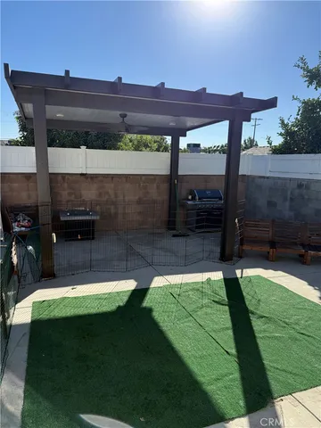 a kitchen with a table chairs sink and cabinets