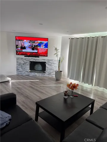 a view of hallway with wooden floor