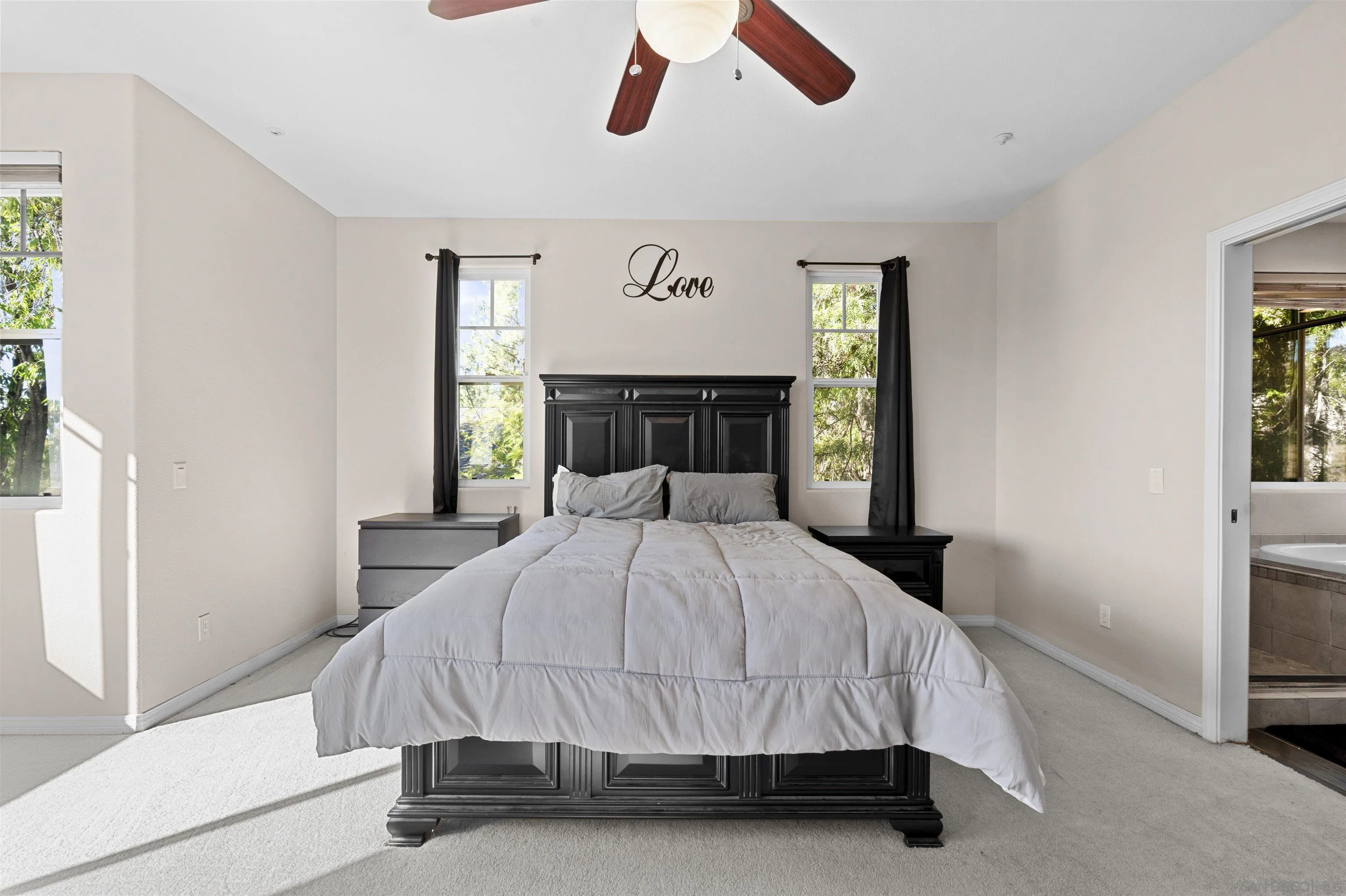 24534 Rutherford Road Ramona, CA 92065 - Photo 12 of 19 a bedroom with a bed and painting on the wall