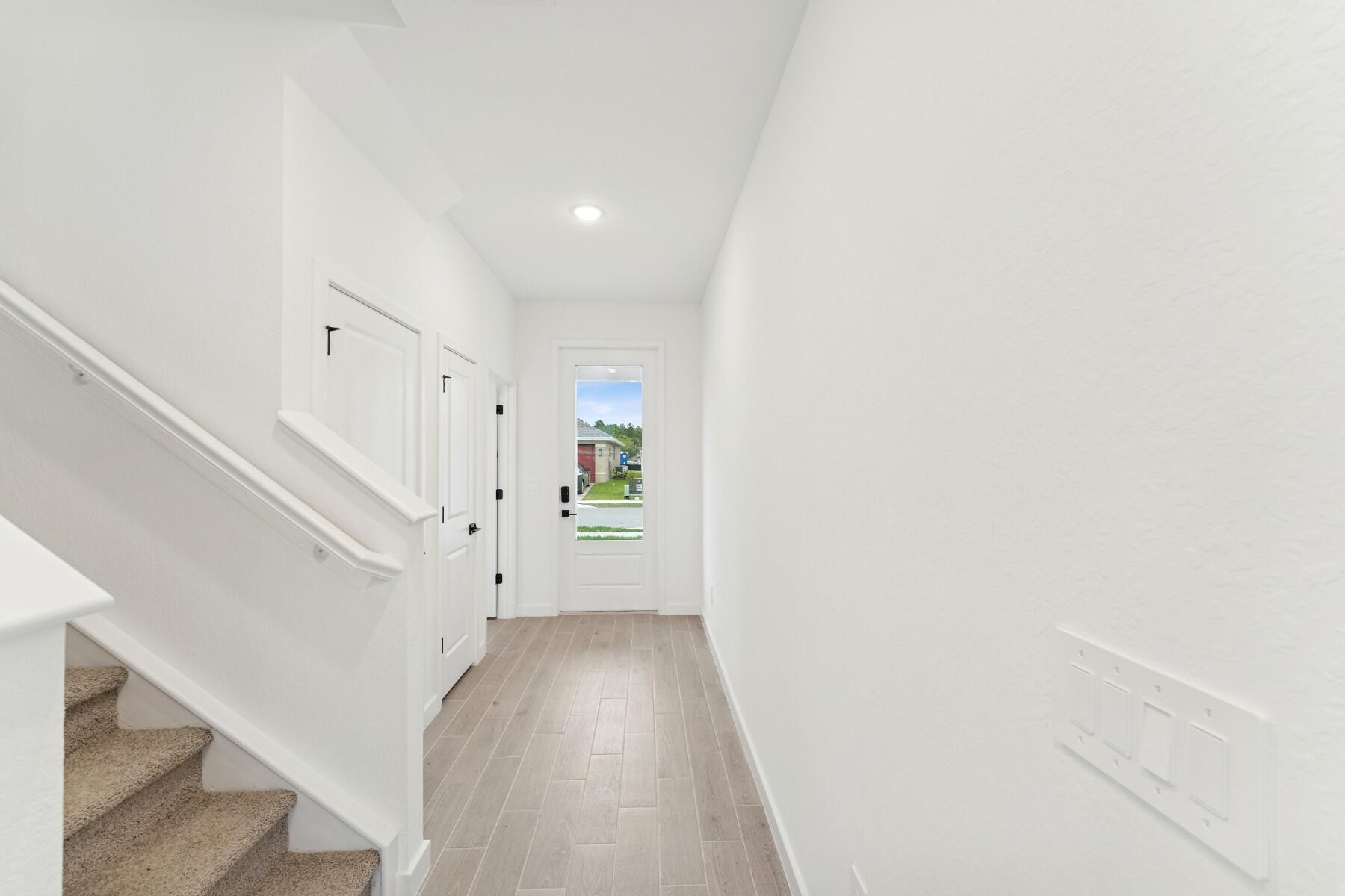 325 Silver Sands Lane, Unit 8 Fort Pierce, FL 34945 - Photo 3 of 47 a view of entryway with wooden floor