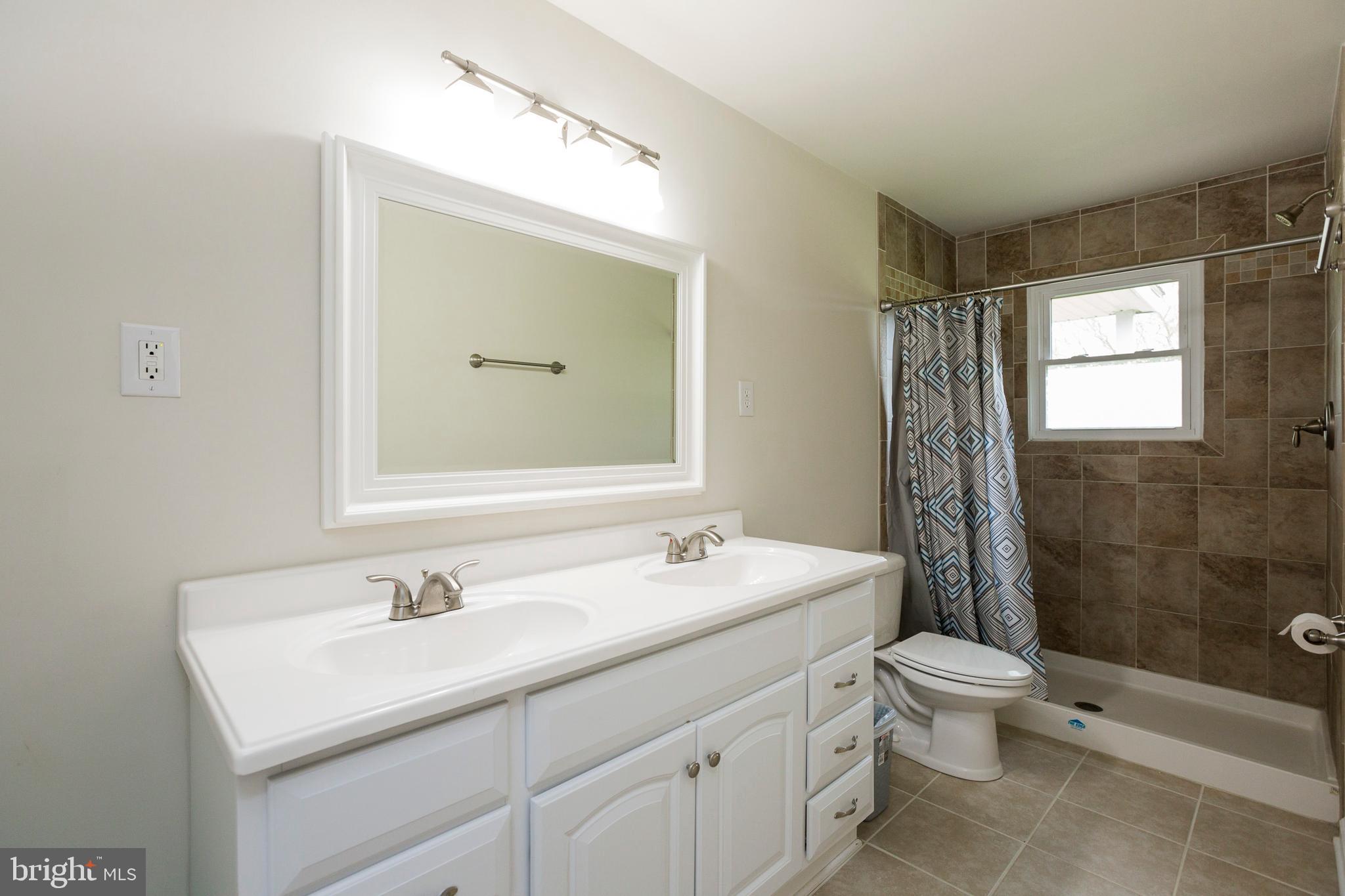 37700 Waterloo Road Coltons Point, MD 20626 - Photo 6 of 27 Master Bath - Walk in shower with tile surround.