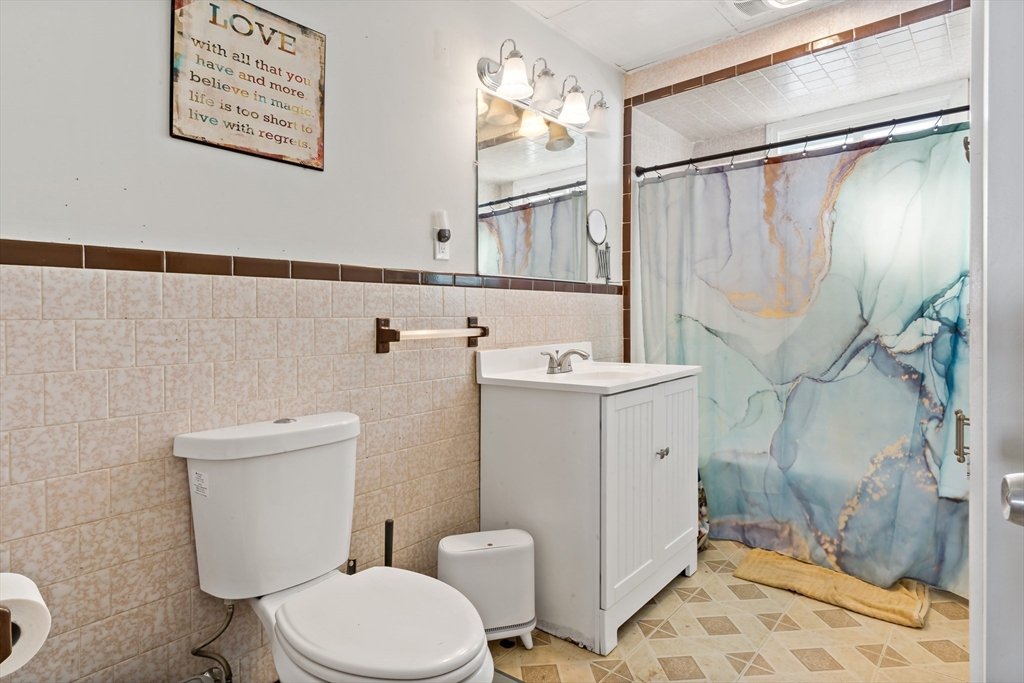 677 Oak Grove Avenue Fall River, MA 02720 - Photo 20 of 26 a bathroom with a sink toilet and shower