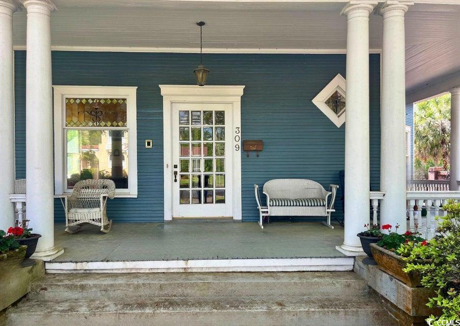 309 North Academy Street Kingstree, SC 29556 - Photo 3 of 38 Property entrance featuring a porch