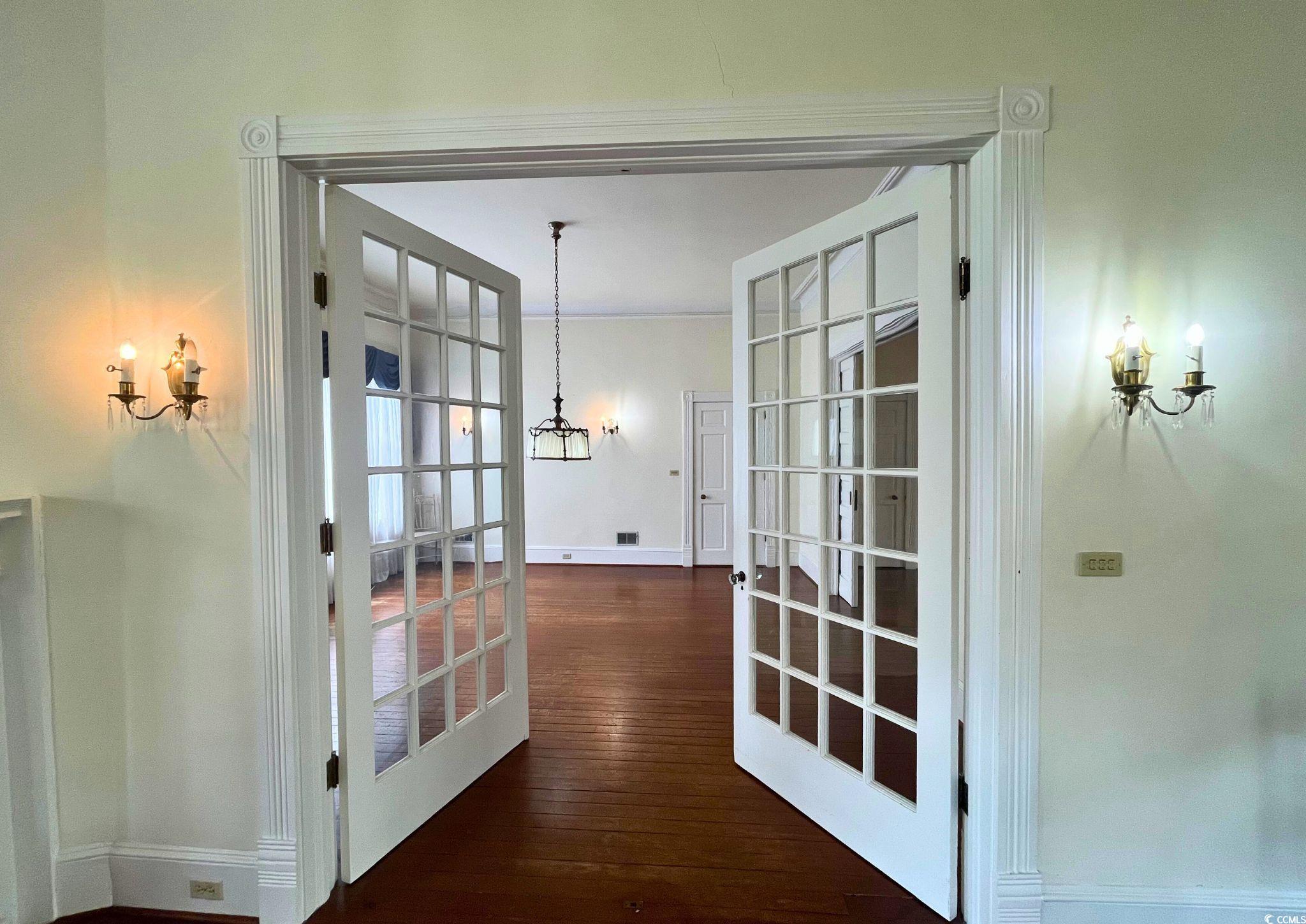 309 North Academy Street Kingstree, SC 29556 - Photo 8 of 38 Entryway with a chandelier, wood-type flooring, and french doors