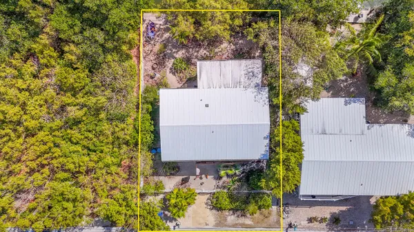front view of a house with a tree